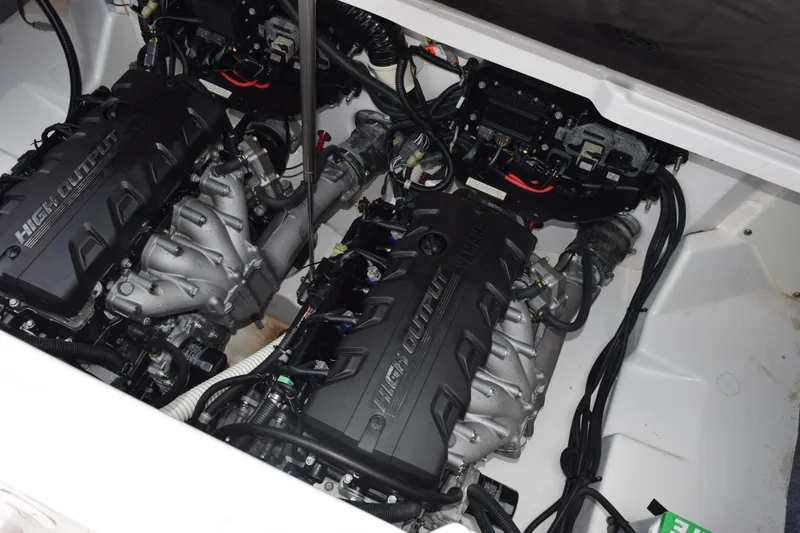 Slide: The Image of 2023 Yamaha AR250 boat engine compartment with high-output engines and wiring. - 24