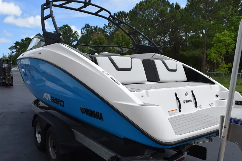 Slide: The Image of 2023 Yamaha Boats AR250 on trailer, featuring sleek design and vibrant blue color. - 5