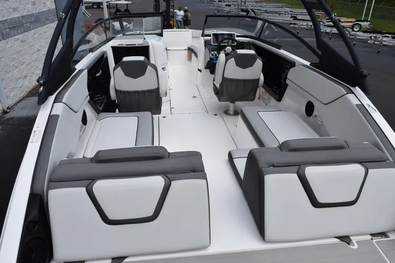 Slide: The Image of 2023 Yamaha Boats AR250 interior with sleek seating and modern design. - 6