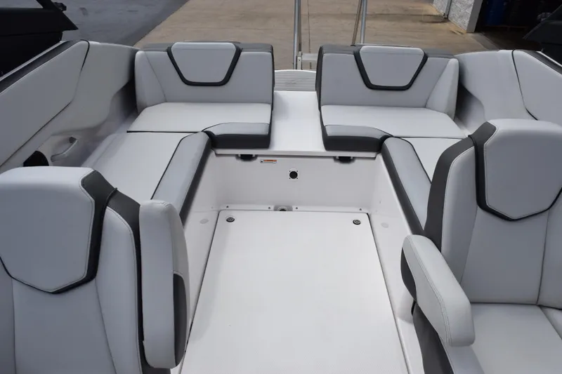 Slide: The Image of 2023 Yamaha Boats AR250 interior with sleek, modern seating design. - 9