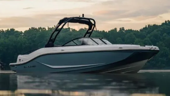 The Image of 2025 Bayliner D20I boat on calm water at sunset. - 1
