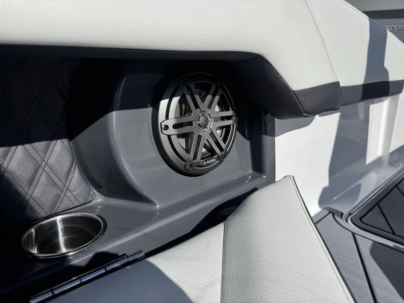 Slide: The Image of Speaker and cup holder in Cobalt R4 boat, model year 2026. - 14