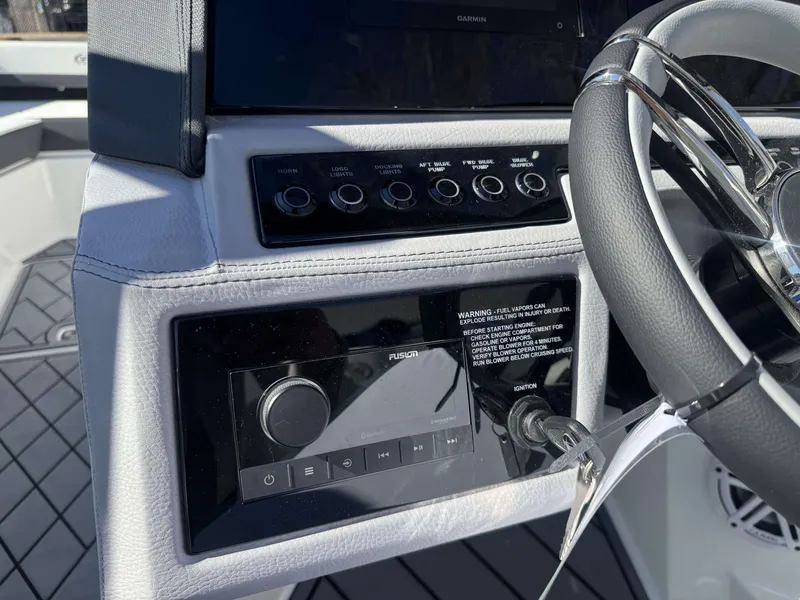 Slide: The Image of Cobalt R4 2026 boat dashboard with steering wheel and controls. - 22