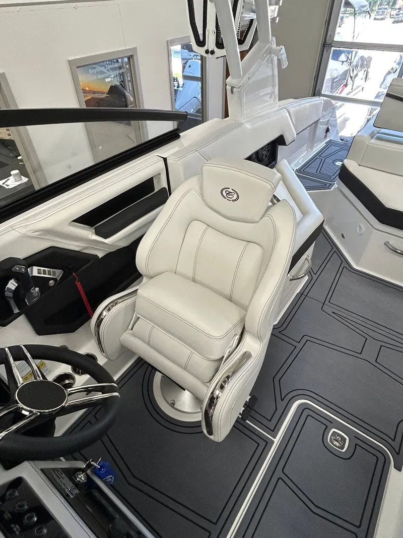 Slide: The Image of Interior of 2025 Cobalt R4 Surf with luxurious captain's chair. - 12