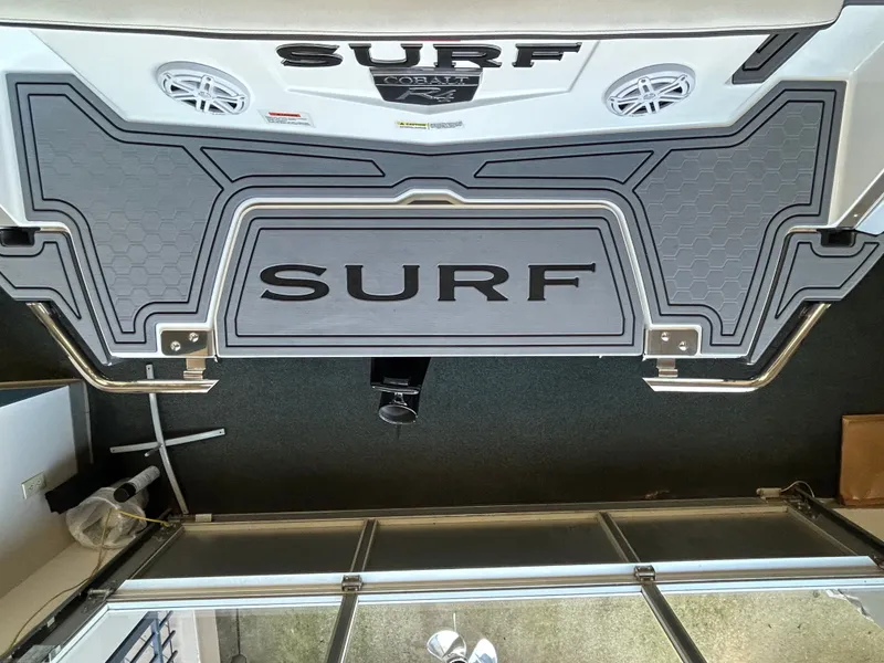 Slide: The Image of Rear view of 2025 Cobalt R4 Surf with surf logo. - 4