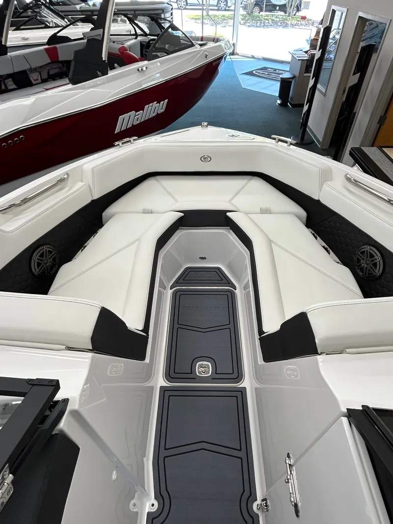 Slide: The Image of Interior view of 2025 Cobalt R4 Surf boat with luxurious white seating. - 8