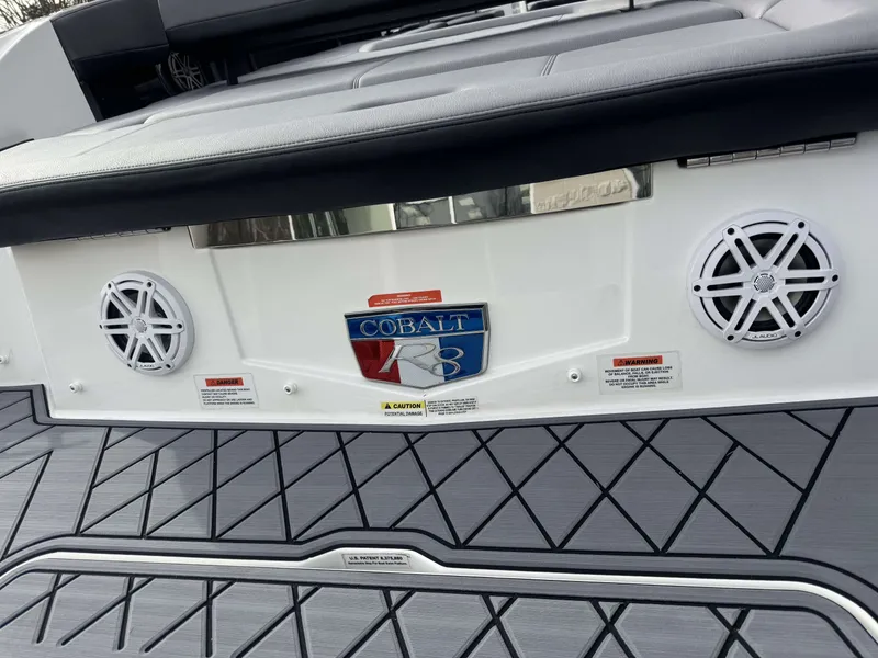 Slide: The Image of Rear view of 2026 Cobalt R8 with speakers and logo. - 32