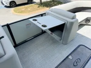 Slide: The Image of 2024 Harris CX 230 boat with fold-out table and cup holders. - 9
