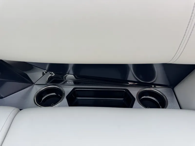 Slide: The Image of Interior of Harris Grand Mariner 230, 2025, featuring cup holders. - 14