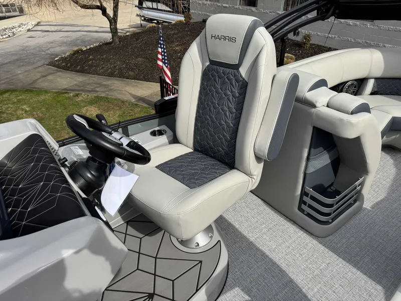 Slide: The Image of Interior of 2025 Harris Grand Mariner 230 with luxurious seating design. - 22