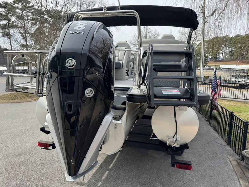 Slide: The Image of 2025 Harris Grand Mariner 230 with powerful V8 engine on trailer. - 43