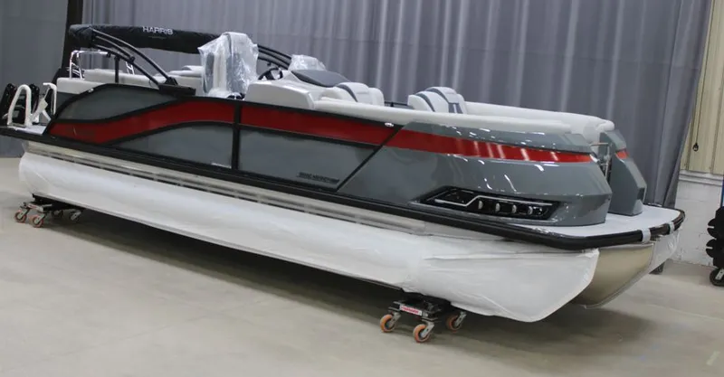 Slide: The Image of 2025 Harris Grand Mariner 230 pontoon boat in a showroom. - 44