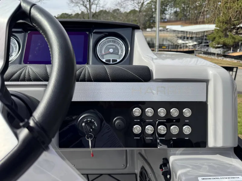 Slide: The Image of Dashboard of 2025 Harris Grand Mariner 230 with steering wheel and controls. - 5