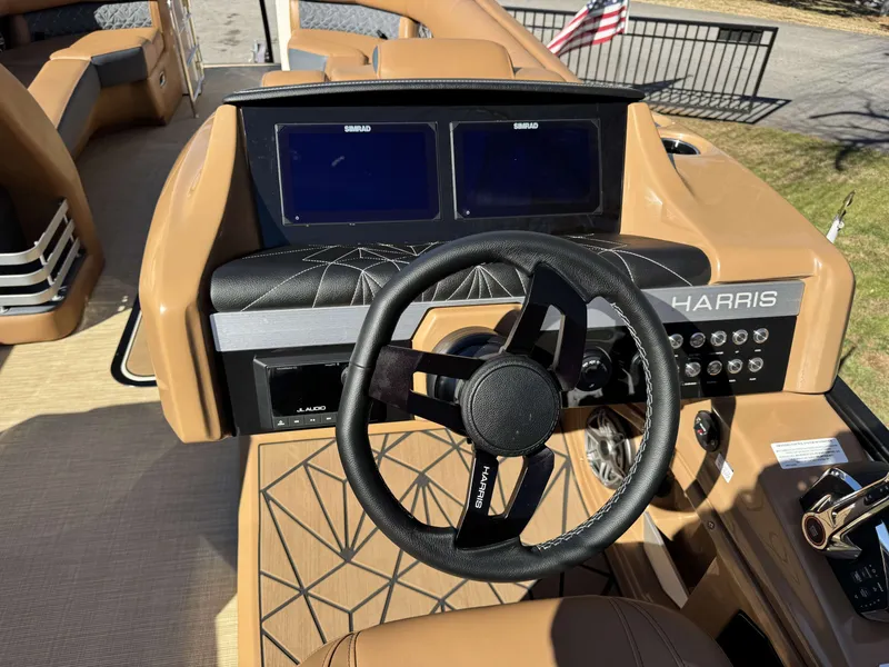 Slide: The Image of 2025 Harris Grand Mariner 250 helm with modern controls and dual displays. - 18