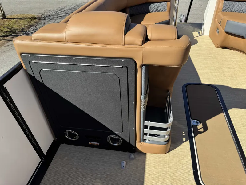 Slide: The Image of Interior of 2025 Harris Grand Mariner 250 with brown leather seating. - 24