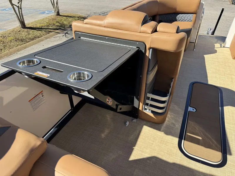 Slide: The Image of Interior of 2025 Harris Grand Mariner 250 with fold-out table. - 25