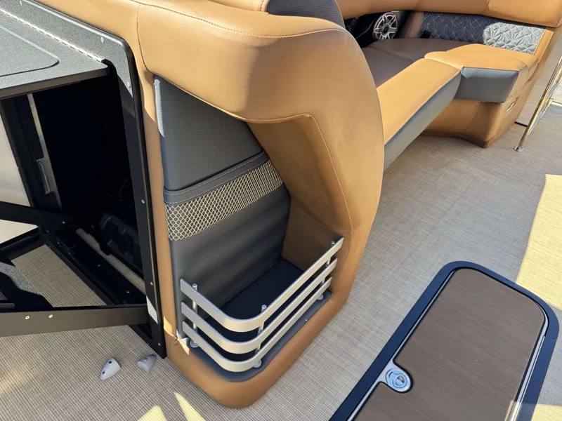 Slide: The Image of Interior of 2025 Harris Grand Mariner 250 with brown leather seating. - 26