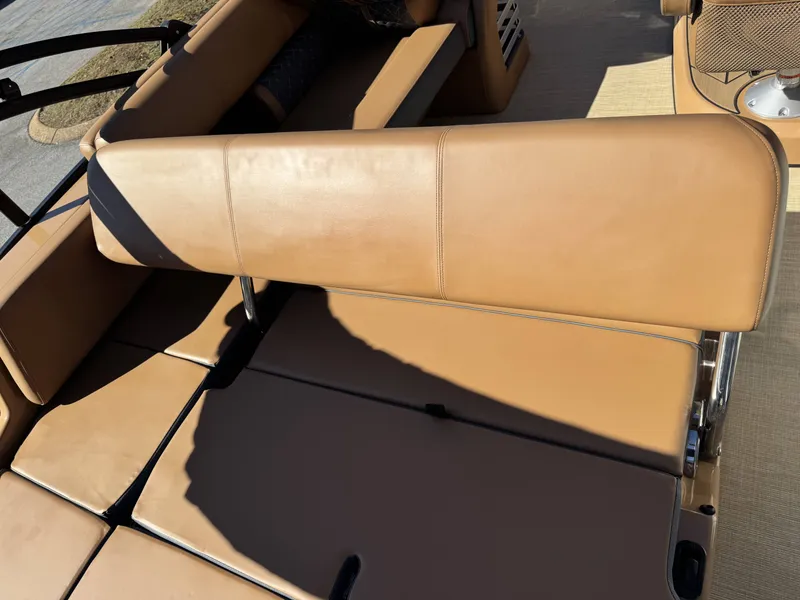 Slide: The Image of Interior of 2025 Harris Grand Mariner 250 with brown leather seating. - 3
