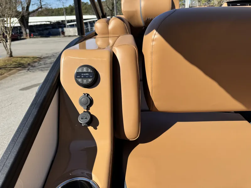 Slide: The Image of Interior of 2025 Harris Grand Mariner 250 with brown leather seats. - 9