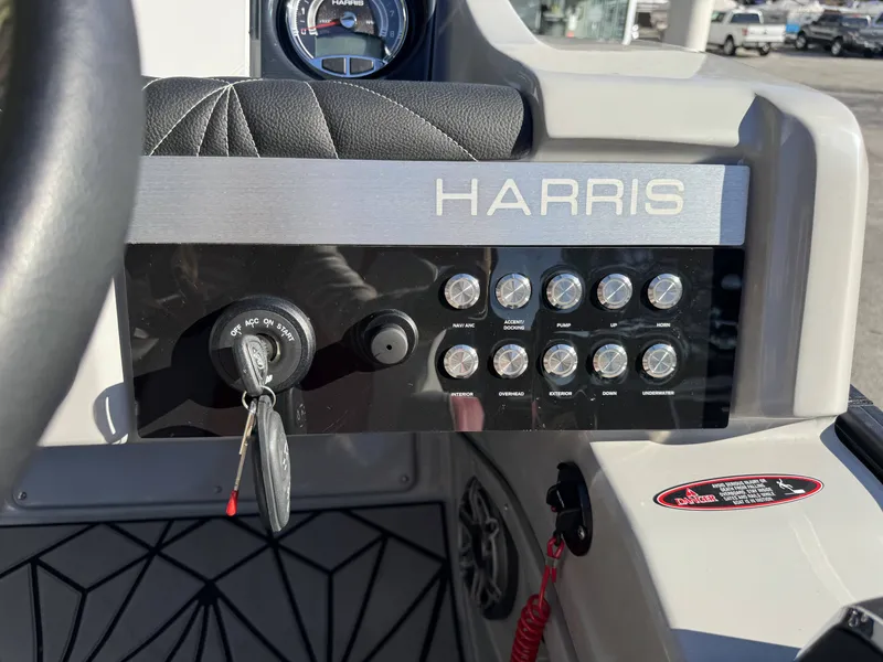 Slide: The Image of Dashboard of 2024 Harris Grand Mariner 250 with switches and ignition key. - 13