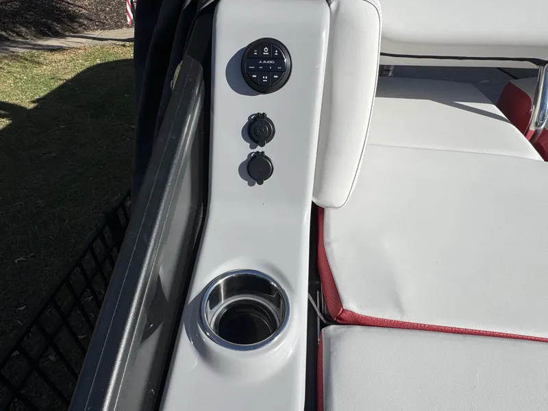 Slide: The Image of 2024 Harris Grand Mariner 250 interior with controls and cup holder. - 16