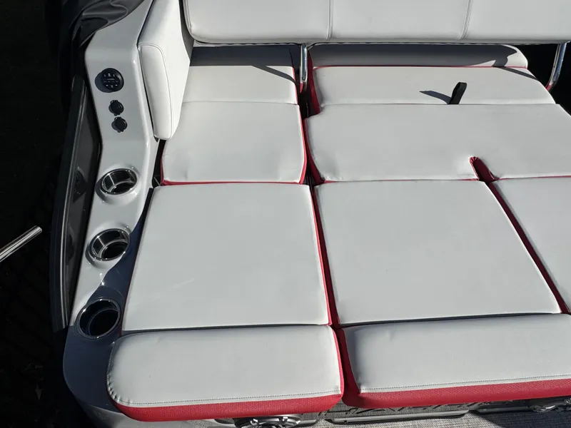 Slide: The Image of 2024 Harris Grand Mariner 250 seating area with white cushions. - 17
