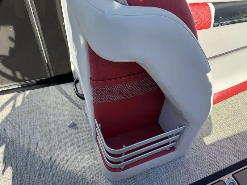 Slide: The Image of Interior of 2024 Harris Grand Mariner 250 with red and gray seating design. - 9