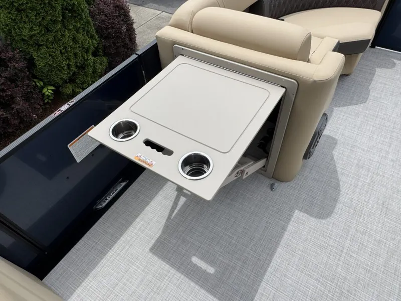 Slide: The Image of Harris SUN 210 2025 boat with fold-out table and cup holders. - 19