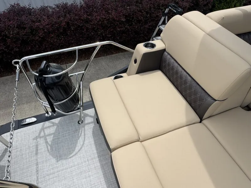 Slide: The Image of Harris SUN 210 boat 2025 with beige seating area and stainless steel railing. - 21
