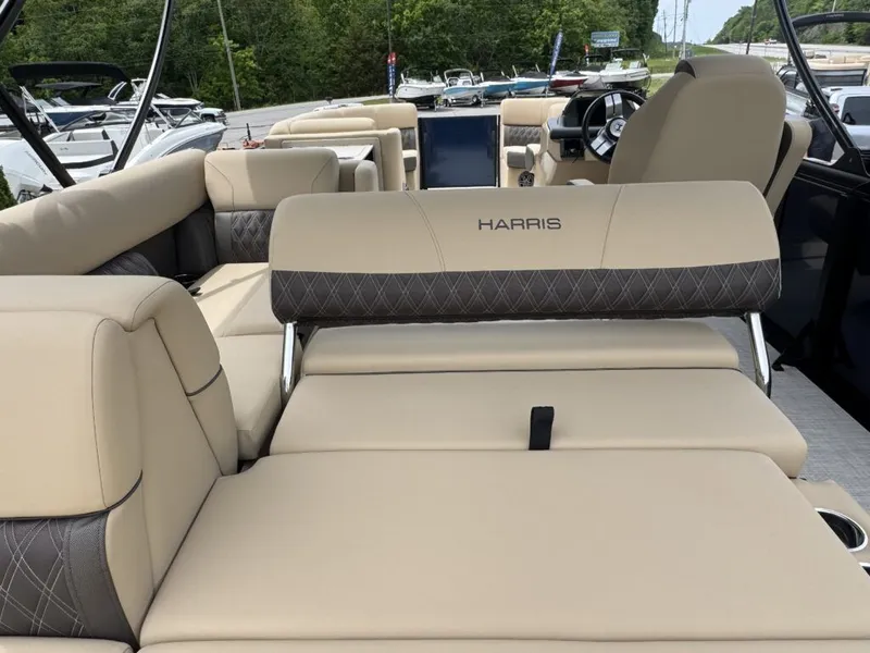 Slide: The Image of Interior of Harris SUN 210 pontoon boat, beige upholstery, model year 2025. - 23