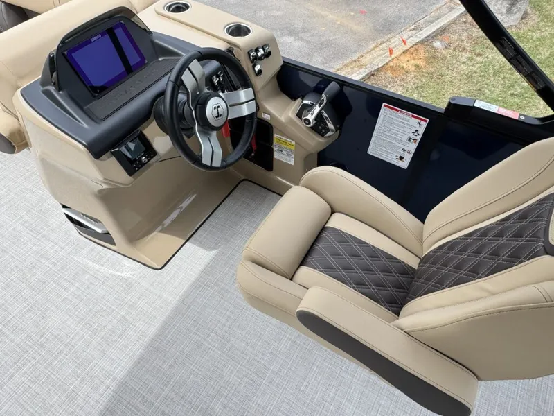 Slide: The Image of Interior of Harris SUN 210 boat, 2025 model, featuring modern helm. - 9