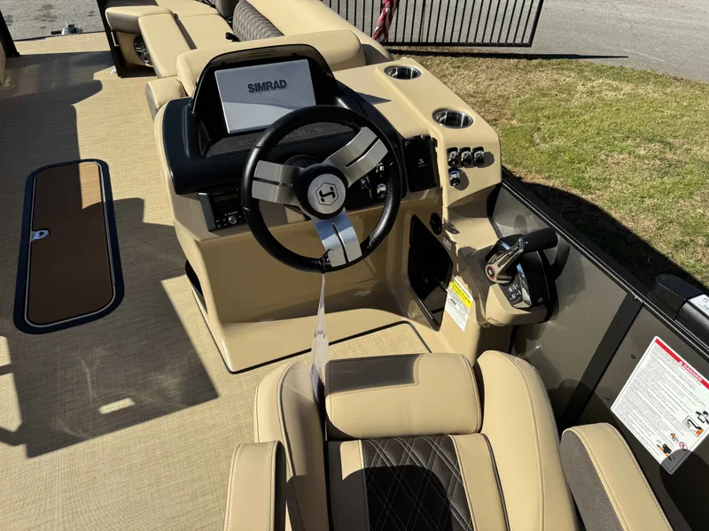 Slide: The Image of Interior of Harris SUN 250 boat, 2025 model, featuring modern helm. - 13