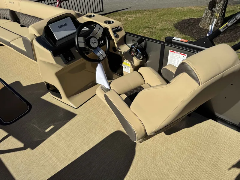 Slide: The Image of Interior of a 2025 Harris SUN 250 boat with beige seating. - 21