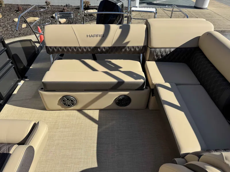 Slide: The Image of Interior of Harris SUN 250 pontoon boat, beige upholstery, speakers, 2025 model. - 7