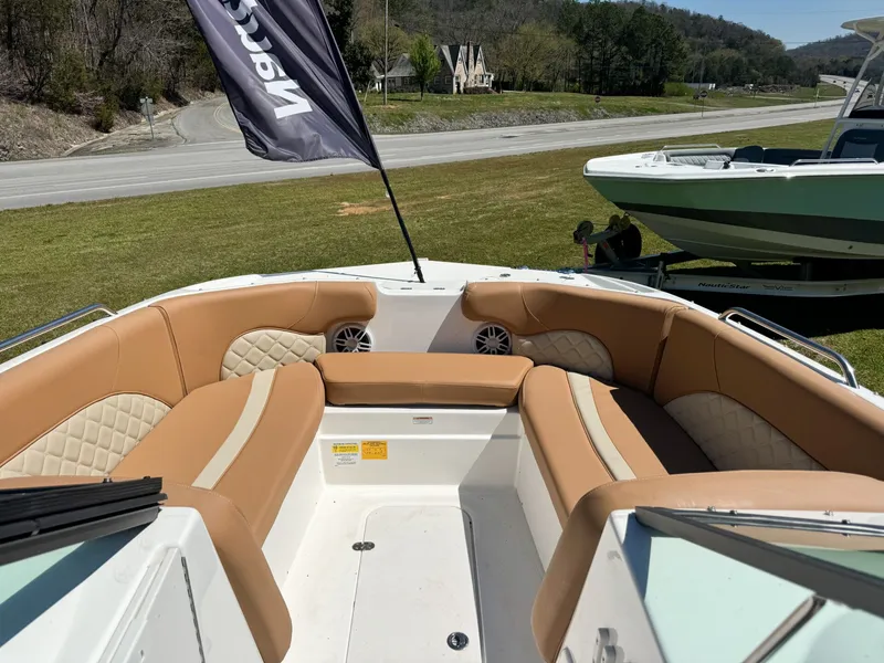 Slide: The Image of 2024 NauticStar 223 DC boat with luxurious interior seating. - 2