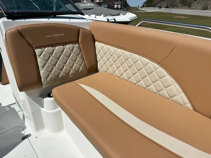 Slide: The Image of 2024 NauticStar 223 DC boat with luxurious upholstery. - 3