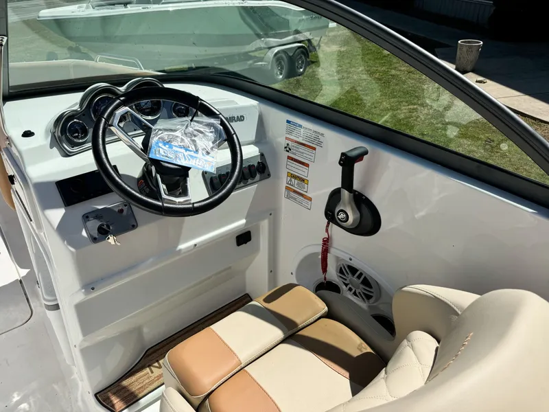 Slide: The Image of Interior view of 2024 NauticStar 223 DC boat cockpit. - 4