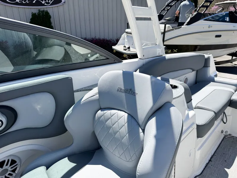 Slide: The Image of 2023 NauticStar 243 DC boat with luxurious gray interior. - 10