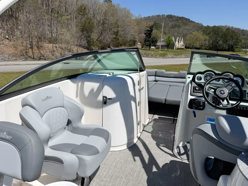 Slide: The Image of Interior of 2023 NauticStar 243 DC boat with gray seating. - 12