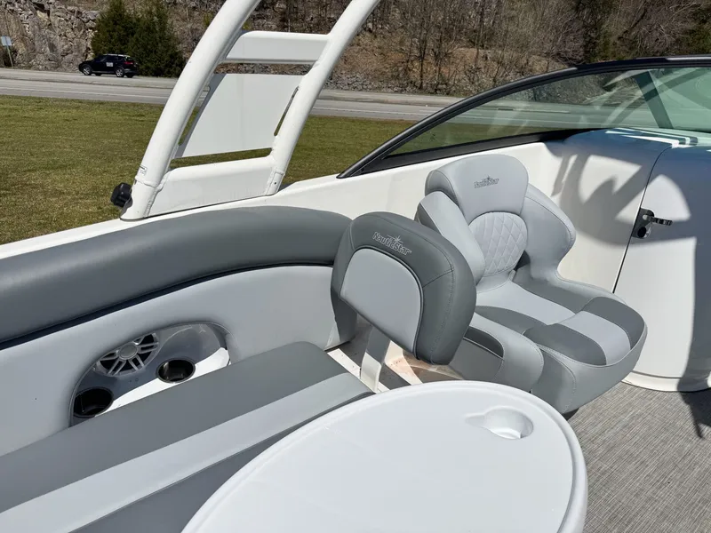 Slide: The Image of Interior of 2023 NauticStar 243 DC with gray seating. - 13