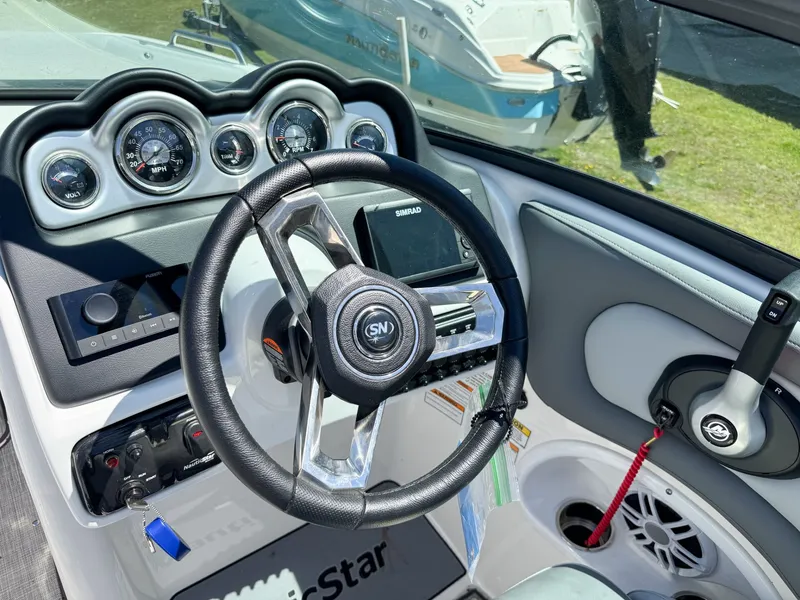 Slide: The Image of Interior view of 2023 NauticStar 243 DC boat cockpit. - 15