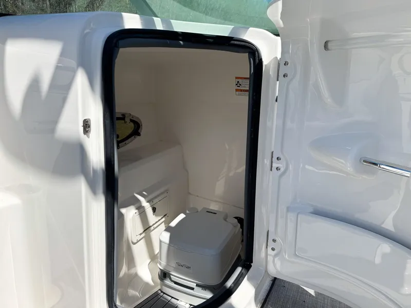 Slide: The Image of Interior of 2023 NauticStar 243 DC featuring a toilet. - 4