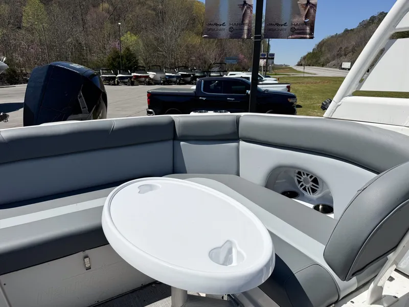 Slide: The Image of Interior of 2023 NauticStar 243 DC with gray seating and table. - 6