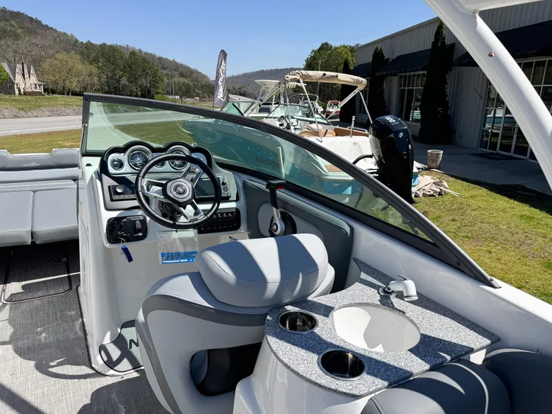 Slide: The Image of Interior view of 2023 NauticStar 243 DC boat with helm console. - 7