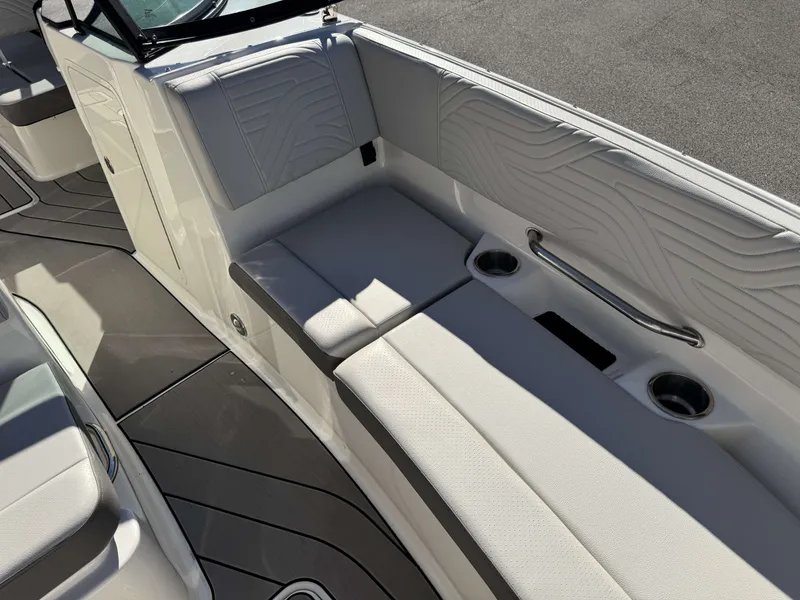 Slide: The Image of Interior of 2025 Sea Ray SDX270 SURF with white upholstery. - 12