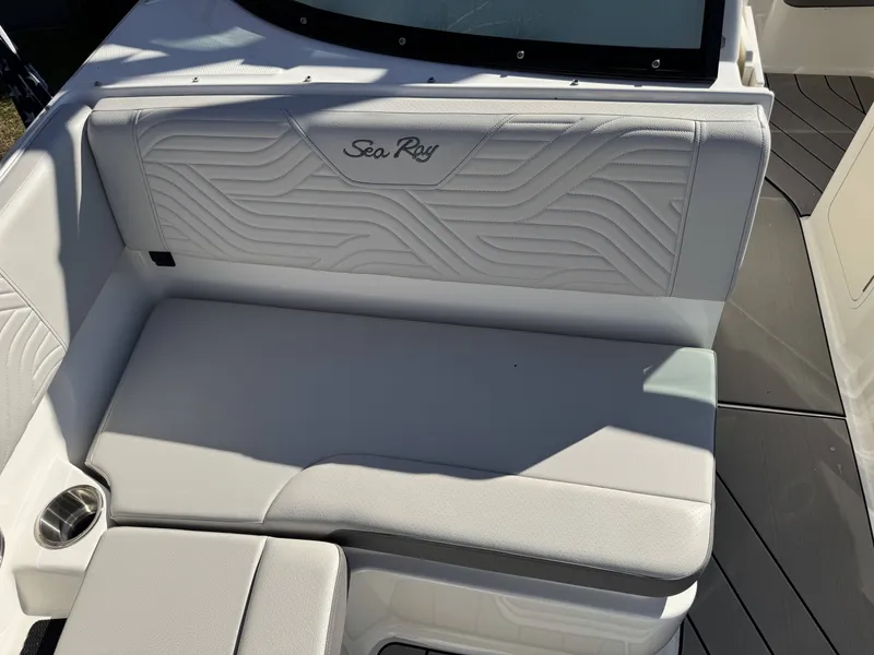 Slide: The Image of Interior of 2025 Sea Ray SDX270 SURF with cushioned seating. - 14