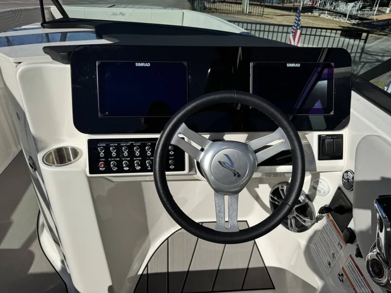 Slide: The Image of 2025 Sea Ray SDX270 SURF helm with Simrad displays. - 19