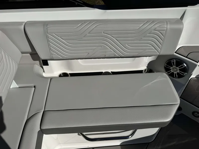 Slide: The Image of Interior of 2025 Sea Ray SDX270 SURF with gray upholstered seating. - 21