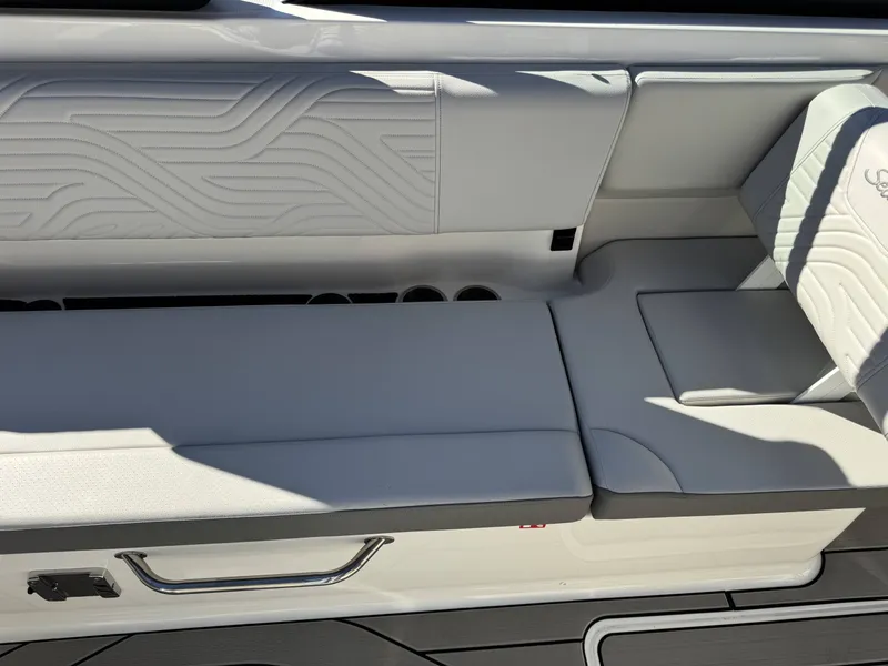 Slide: The Image of Interior of 2025 Sea Ray SDX270 SURF with sleek white seating. - 26