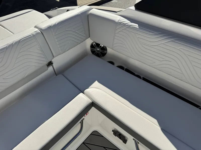 Slide: The Image of Interior of 2025 Sea Ray SDX270 SURF with sleek white upholstery. - 27
